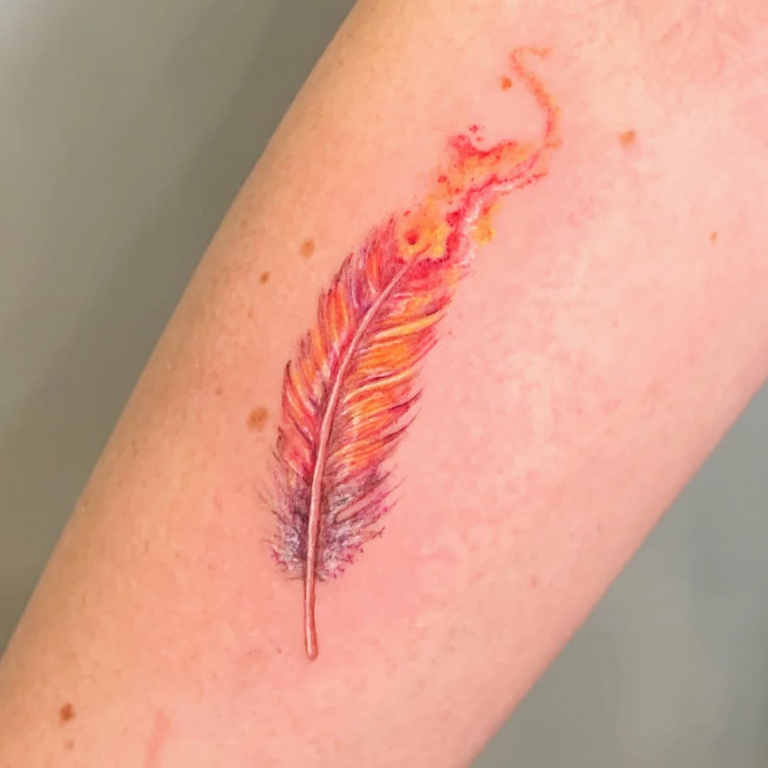 Vibrant feather tattoo with artistic flair