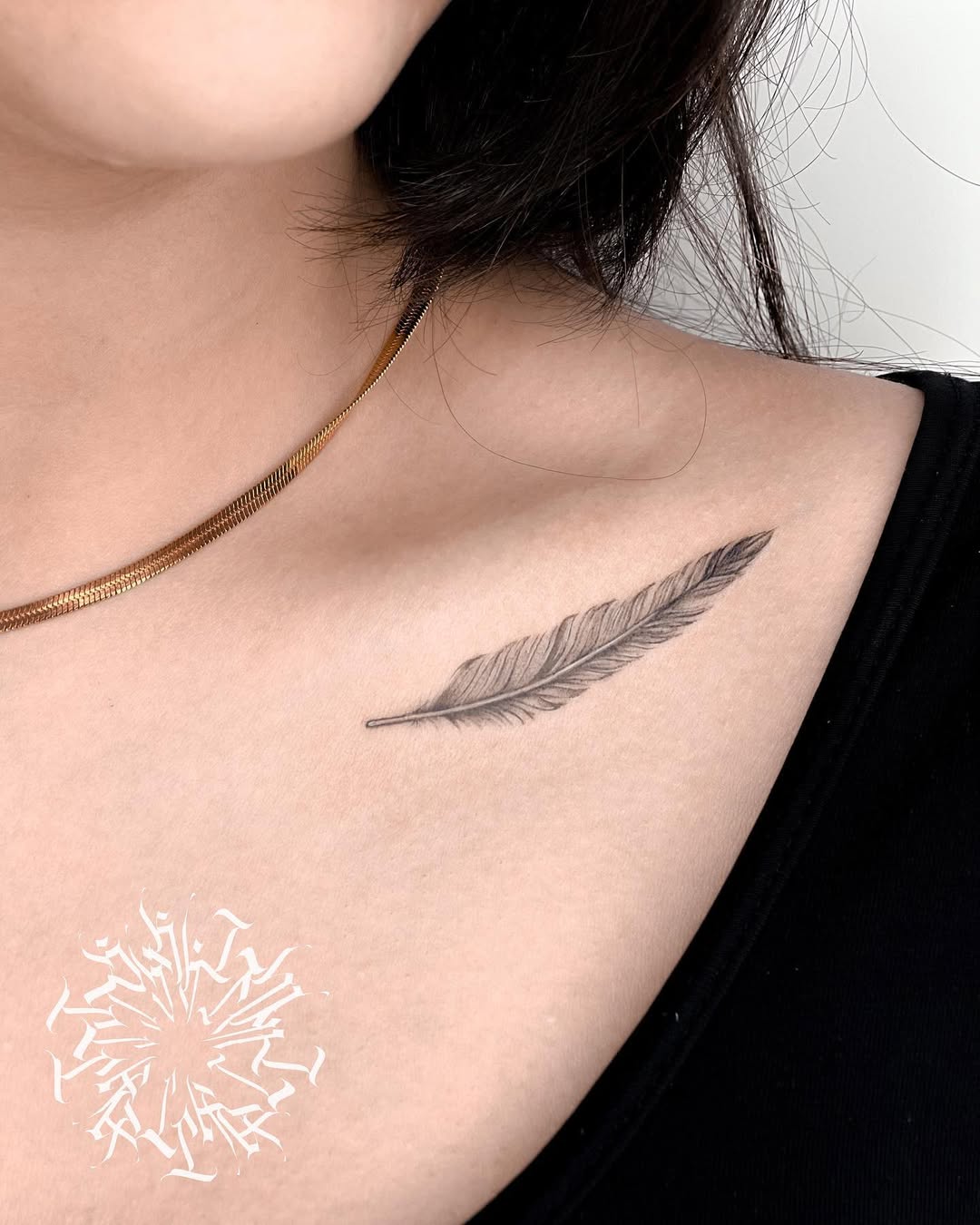 Elegant Feather Tattoo on Delicate Skin