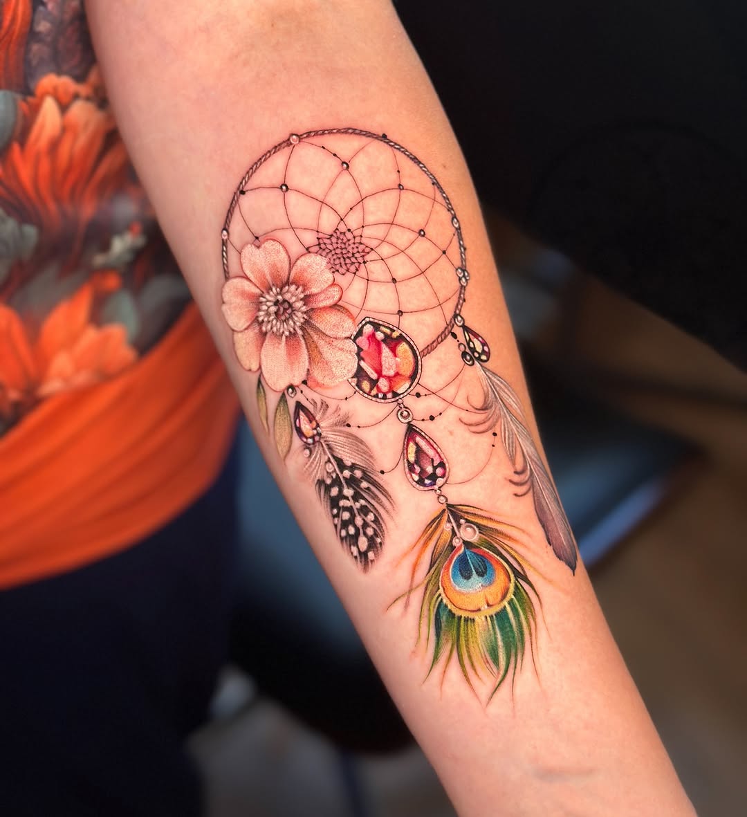 Colorful dreamcatcher inspired feather tattoos