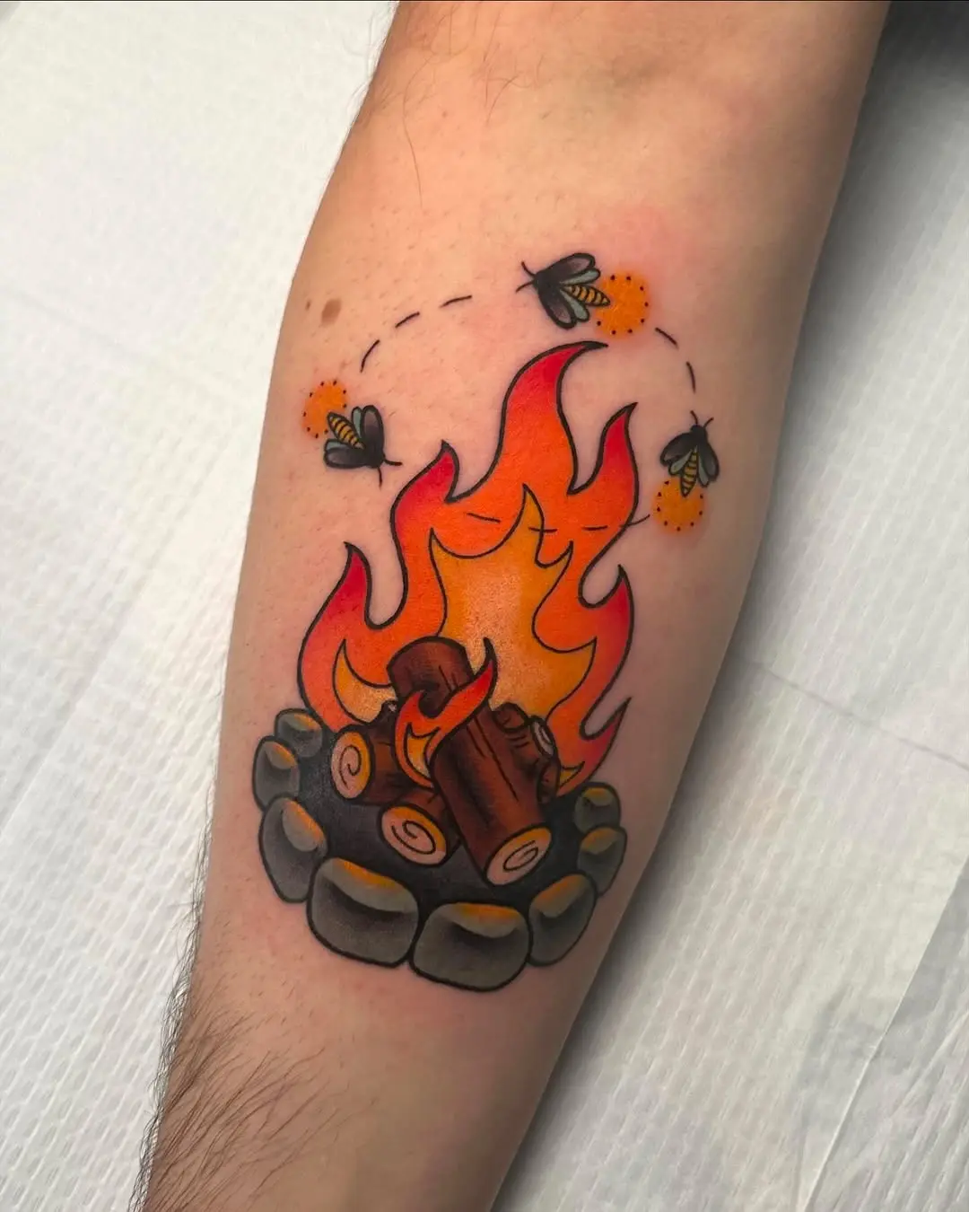 Vibrant Campfire Tattoo with Playful Details