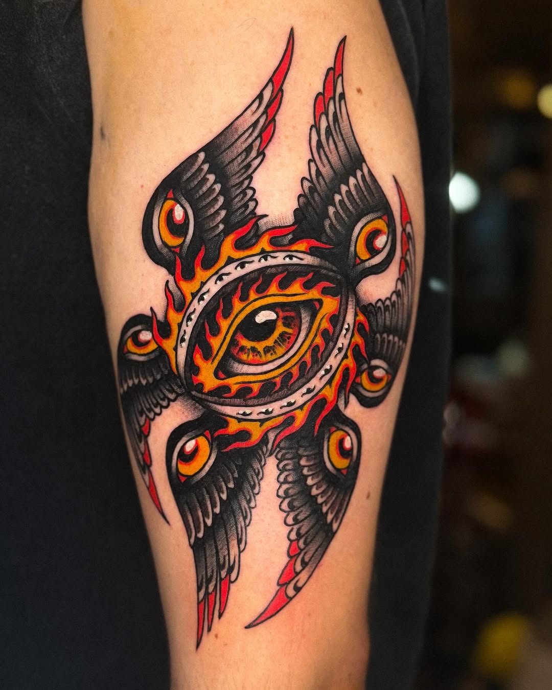Vibrant Fire Tattoo with Winged Design
