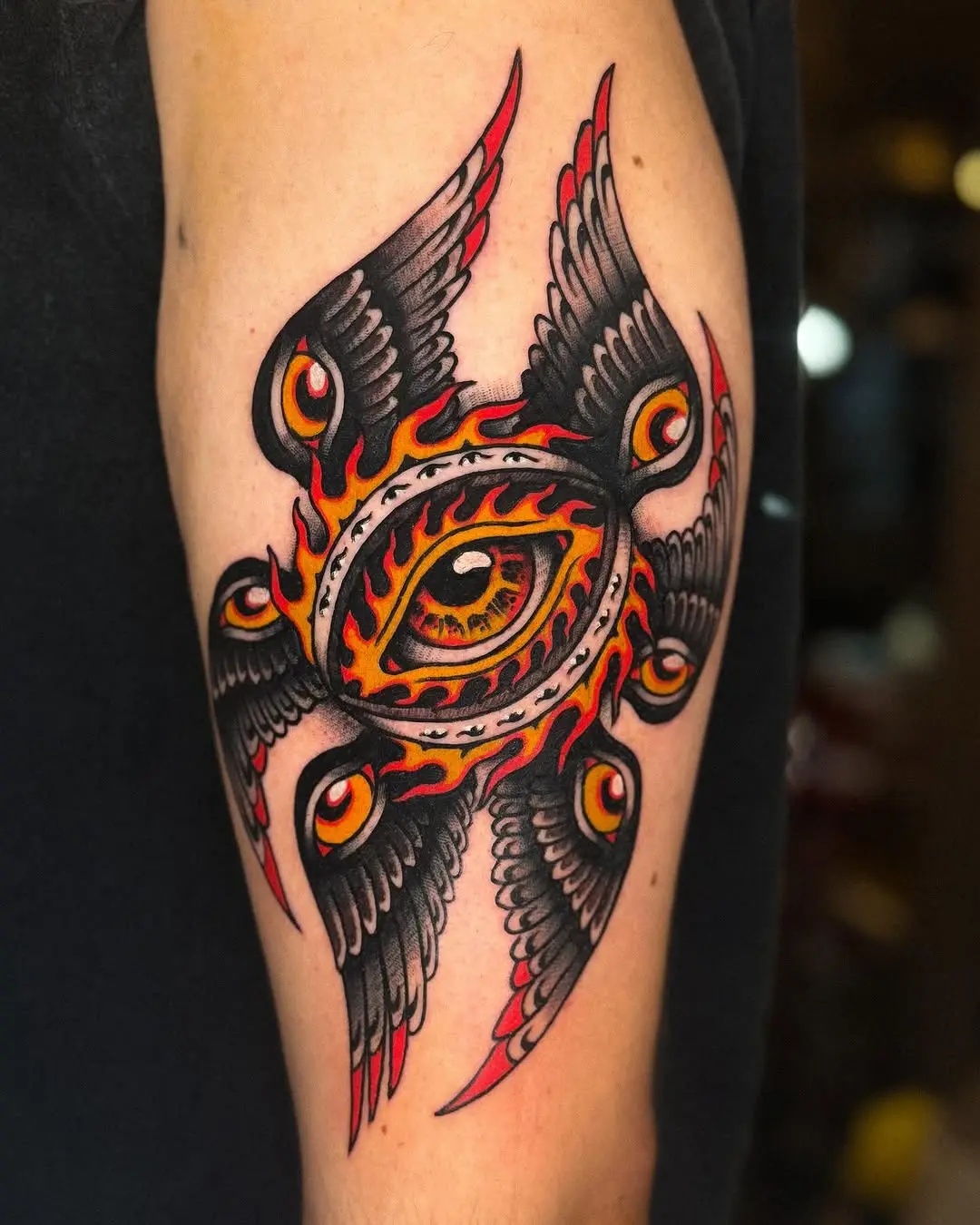 Vibrant Fire Tattoo with Winged Design