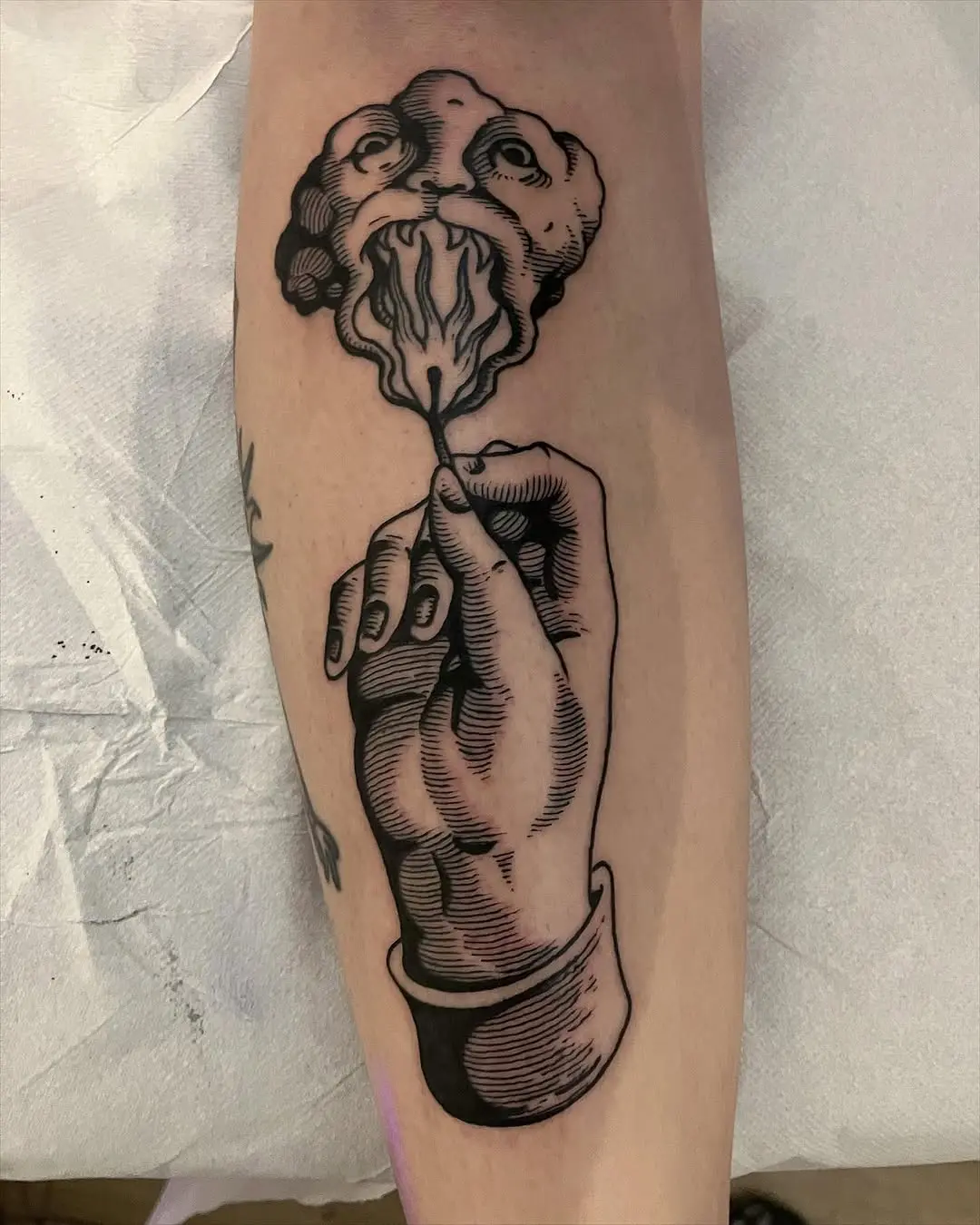 Striking Fire Tattoo Showcasing Bold Hand Design