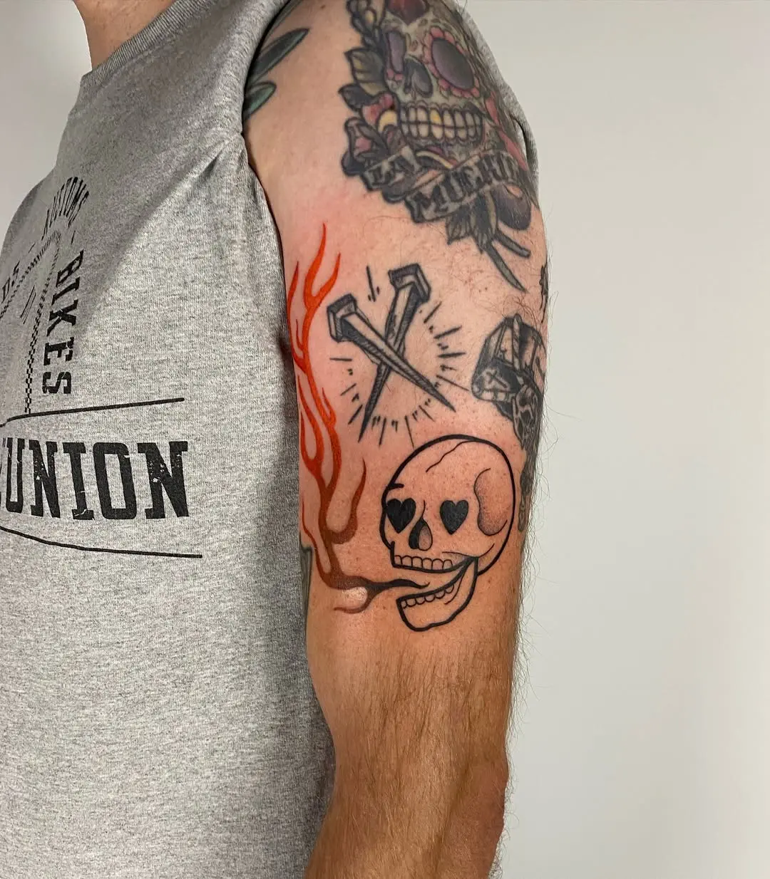 A striking skull tattoo amidst fiery flames
