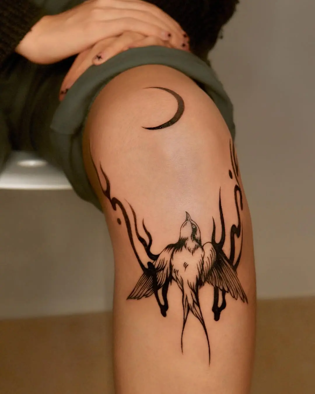Elegant fire-themed bird tattoo design