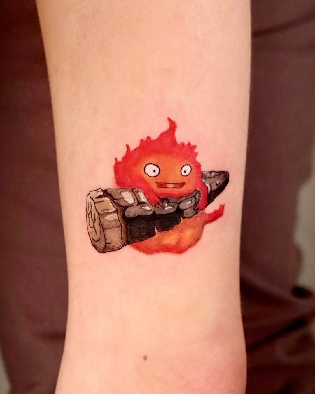 Whimsical fire tattoo with sushi vibes