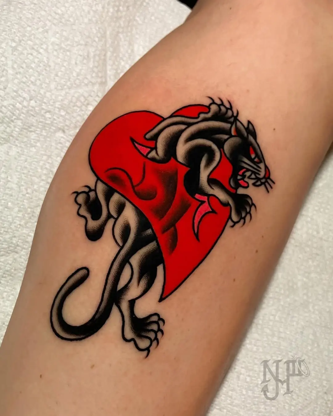 Striking fire panther tattoo on skin