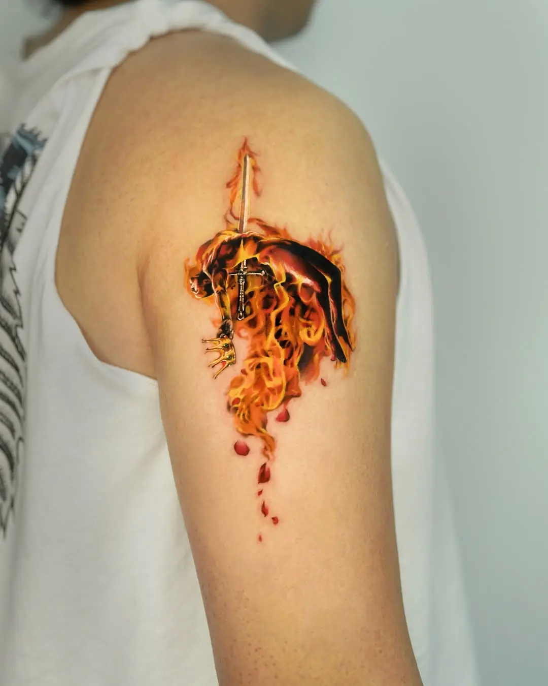 Vibrant fire and sword tattoo design