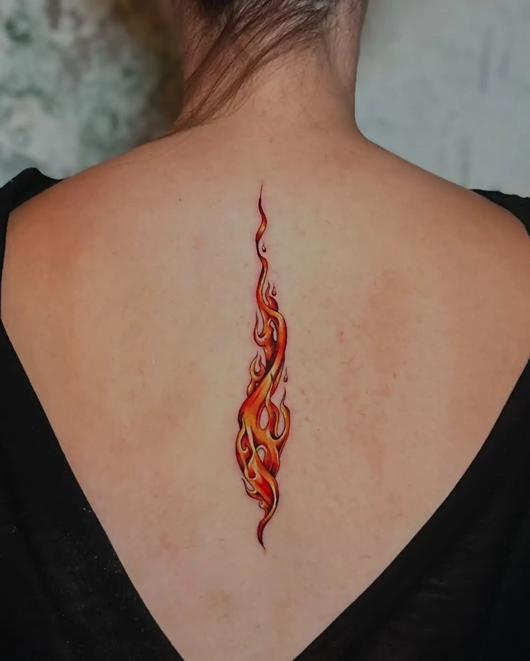 Stylish Vertical Flame Tattoo on Back