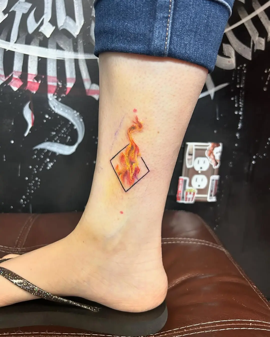 Stylish Fire Tattoo with Geometric Touch