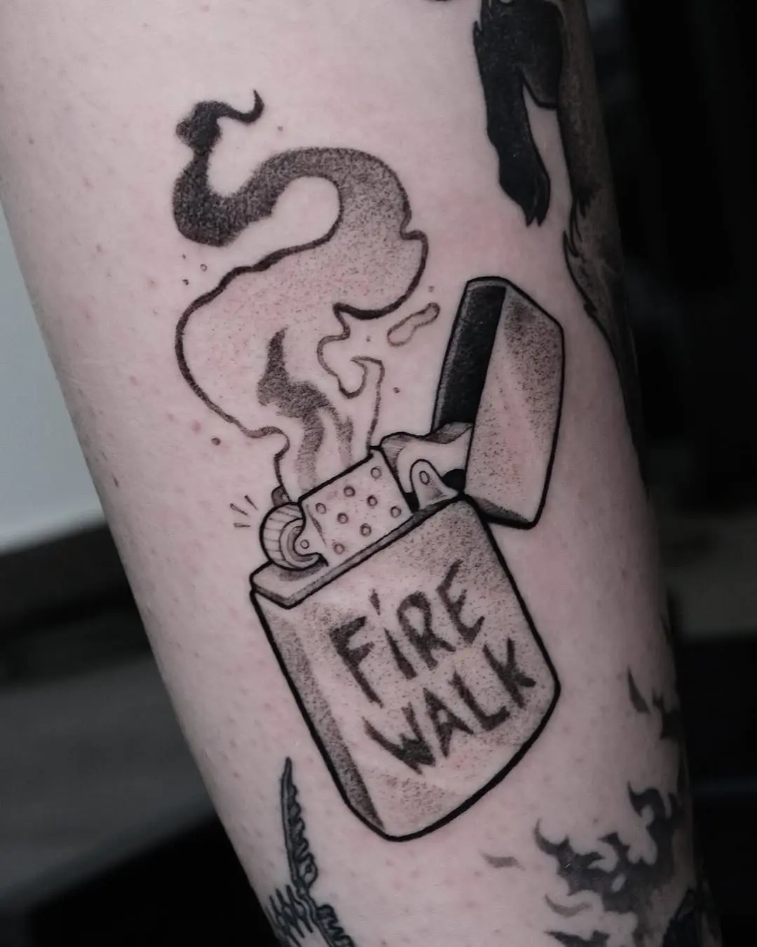 Illustrative fire walk tattoo with lighter design