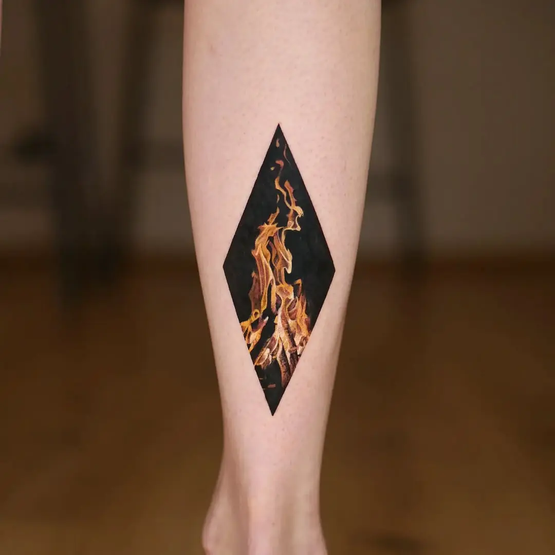 Bold flames within a diamond tattoo design