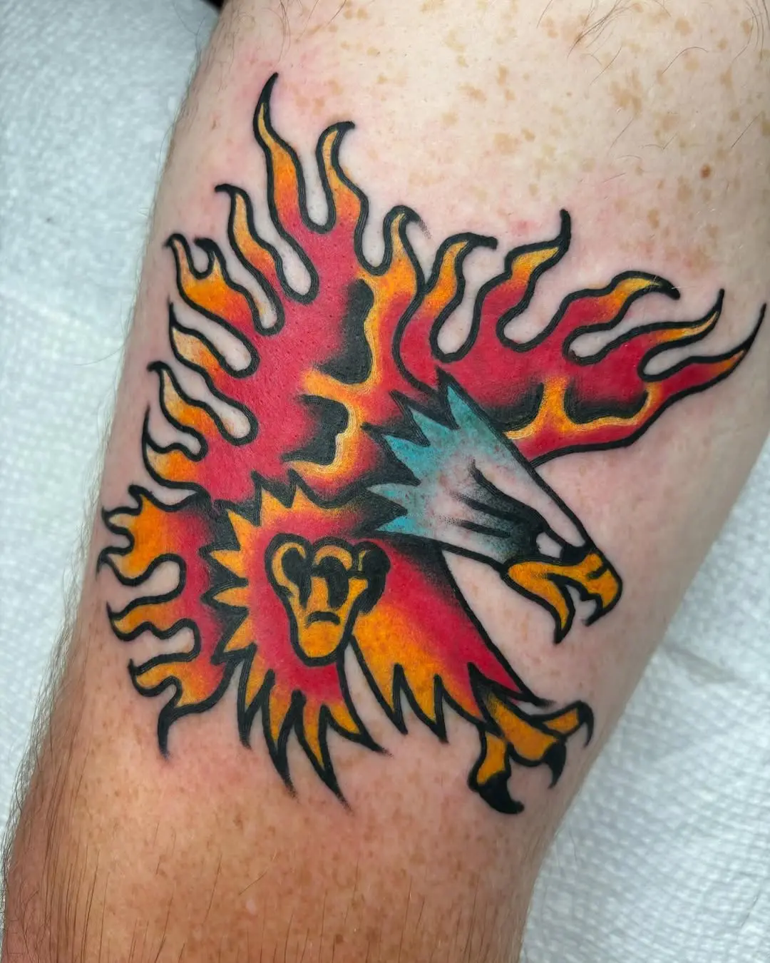 Dynamic flaming lion tattoo design with vibrant colors