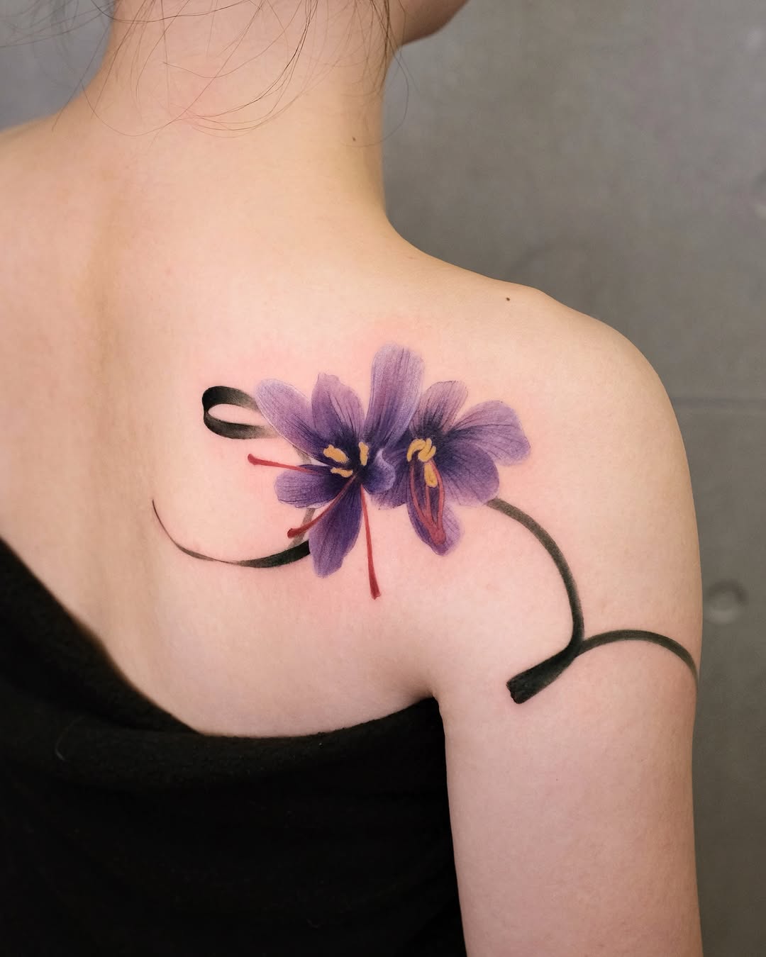 Vibrant floral tattoo on the shoulder