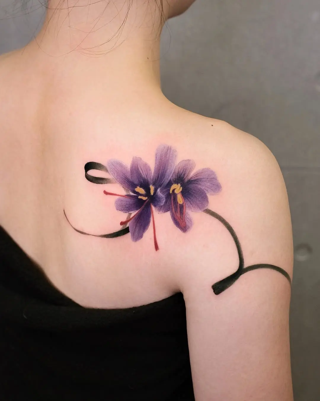 Vibrant floral tattoo on the shoulder