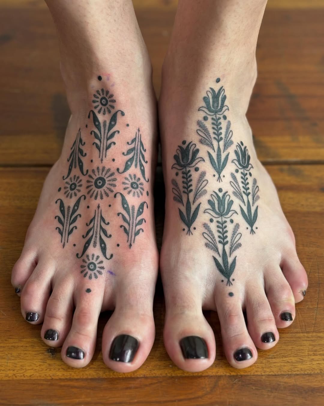 Elegant floral designs on foot tattoos