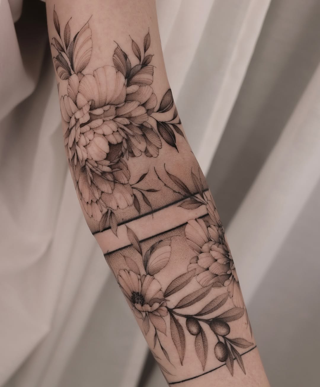 Intricate floral sleeve tattoo showcasing elegance