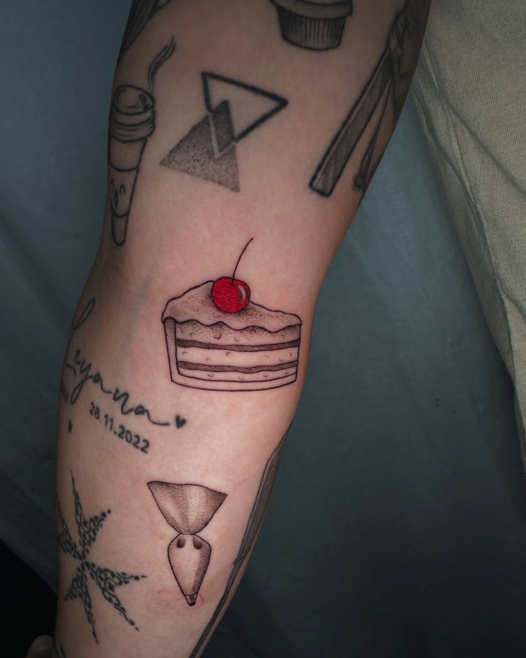 Delicious cake tattoo with cherry on top