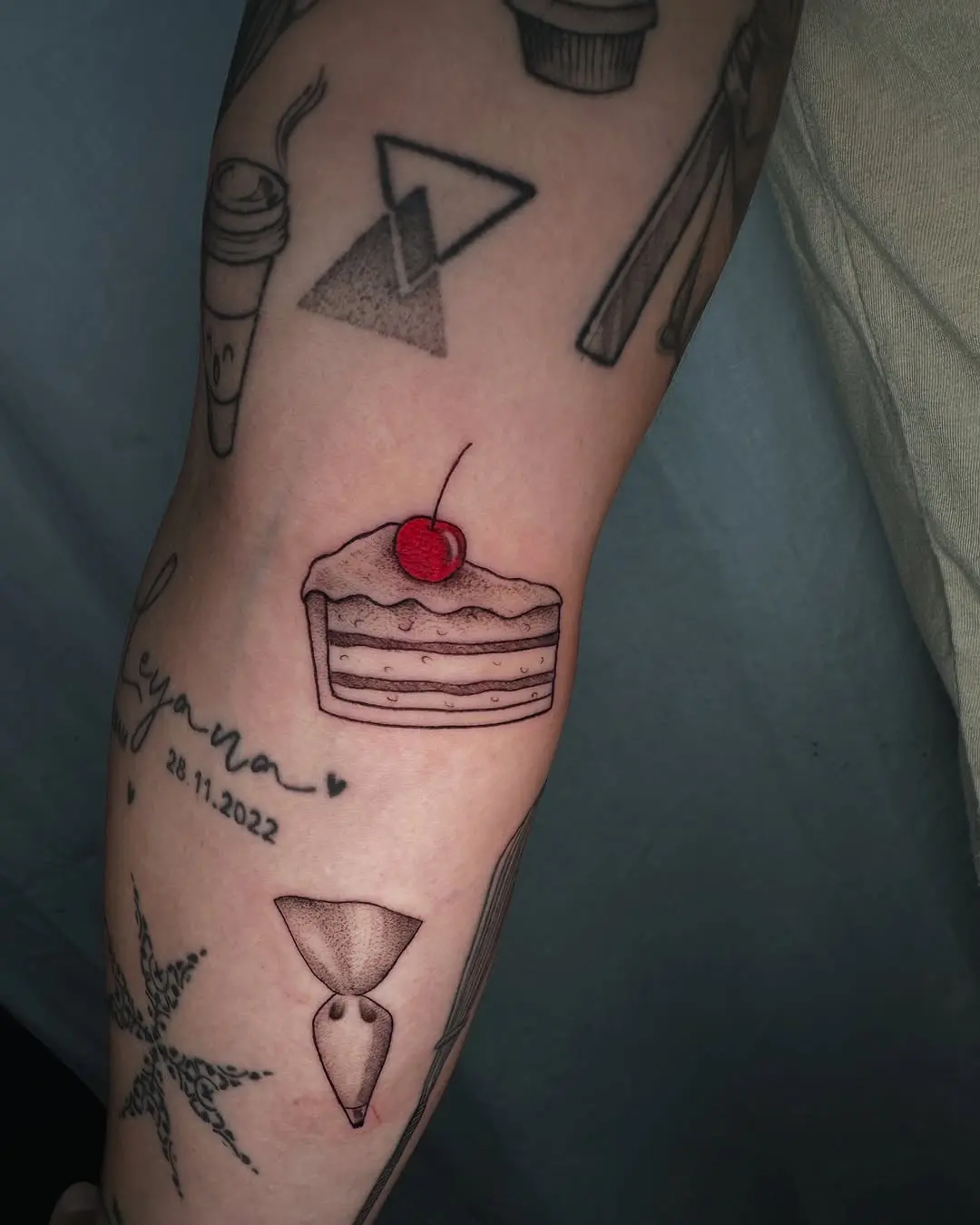 Delicious cake tattoo with cherry on top