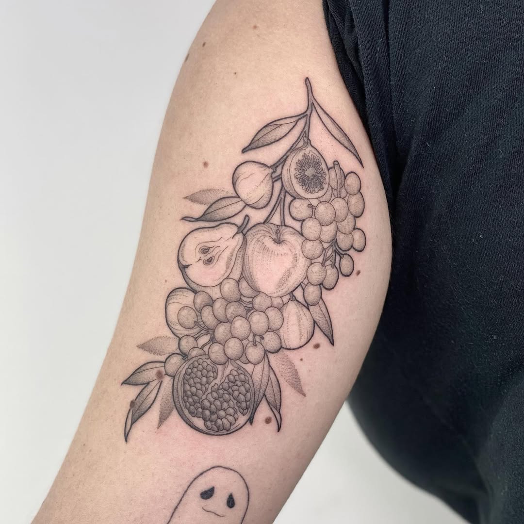 Beautifully detailed fruit-themed culinary tattoo