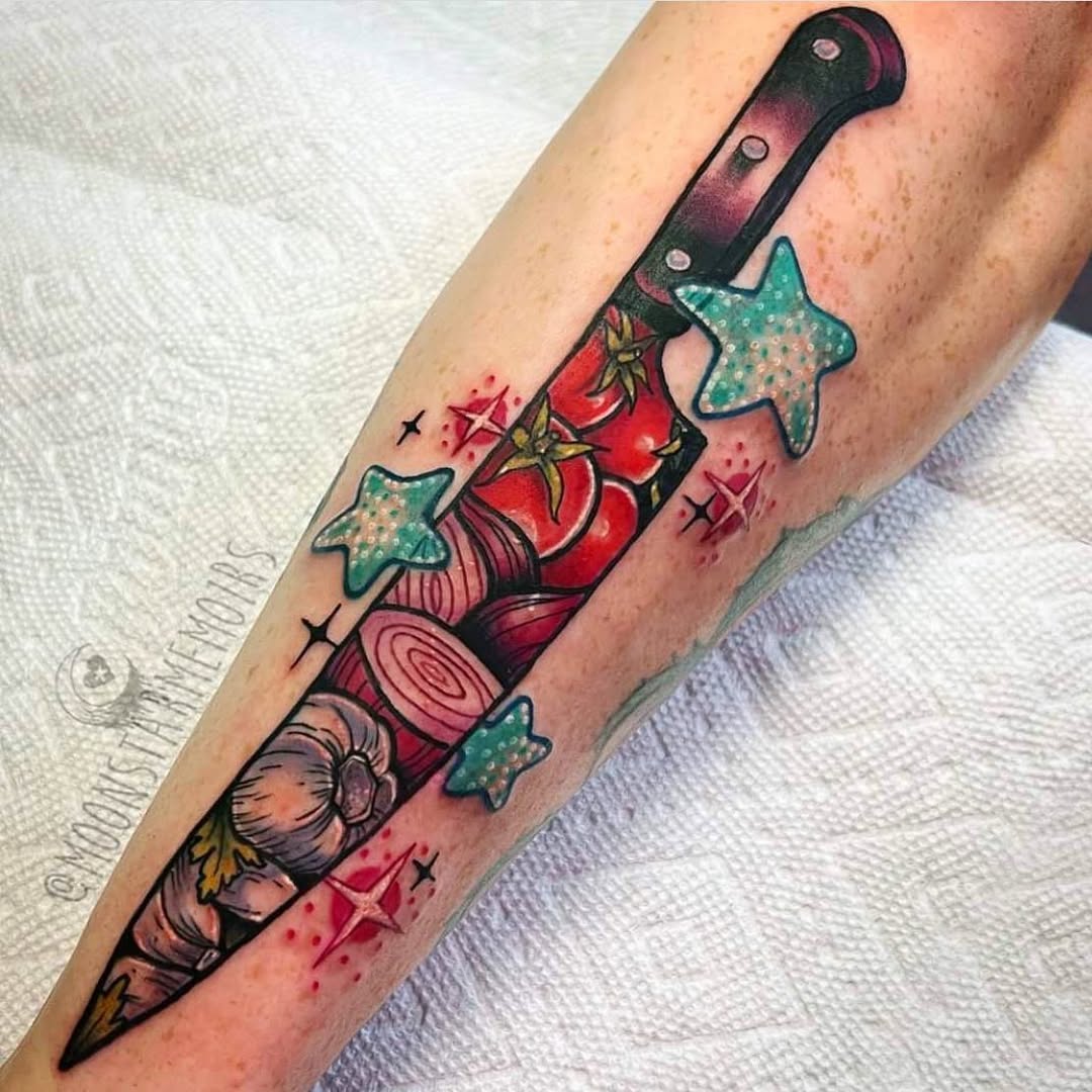 Vibrant knife tattoo infused with culinary inspiration