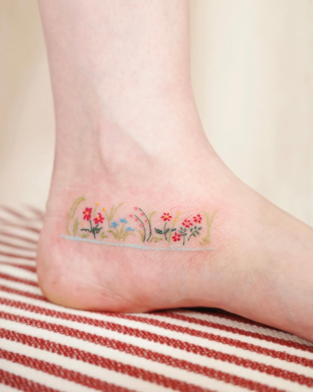 Vibrant Floral Foot Tattoo Design for Nature Lovers
