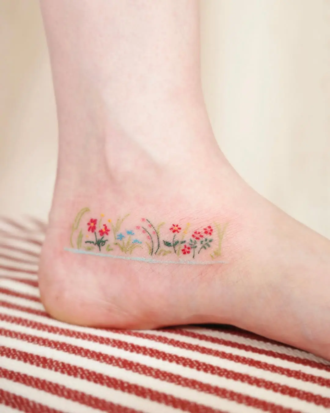 Vibrant Floral Foot Tattoo Design for Nature Lovers
