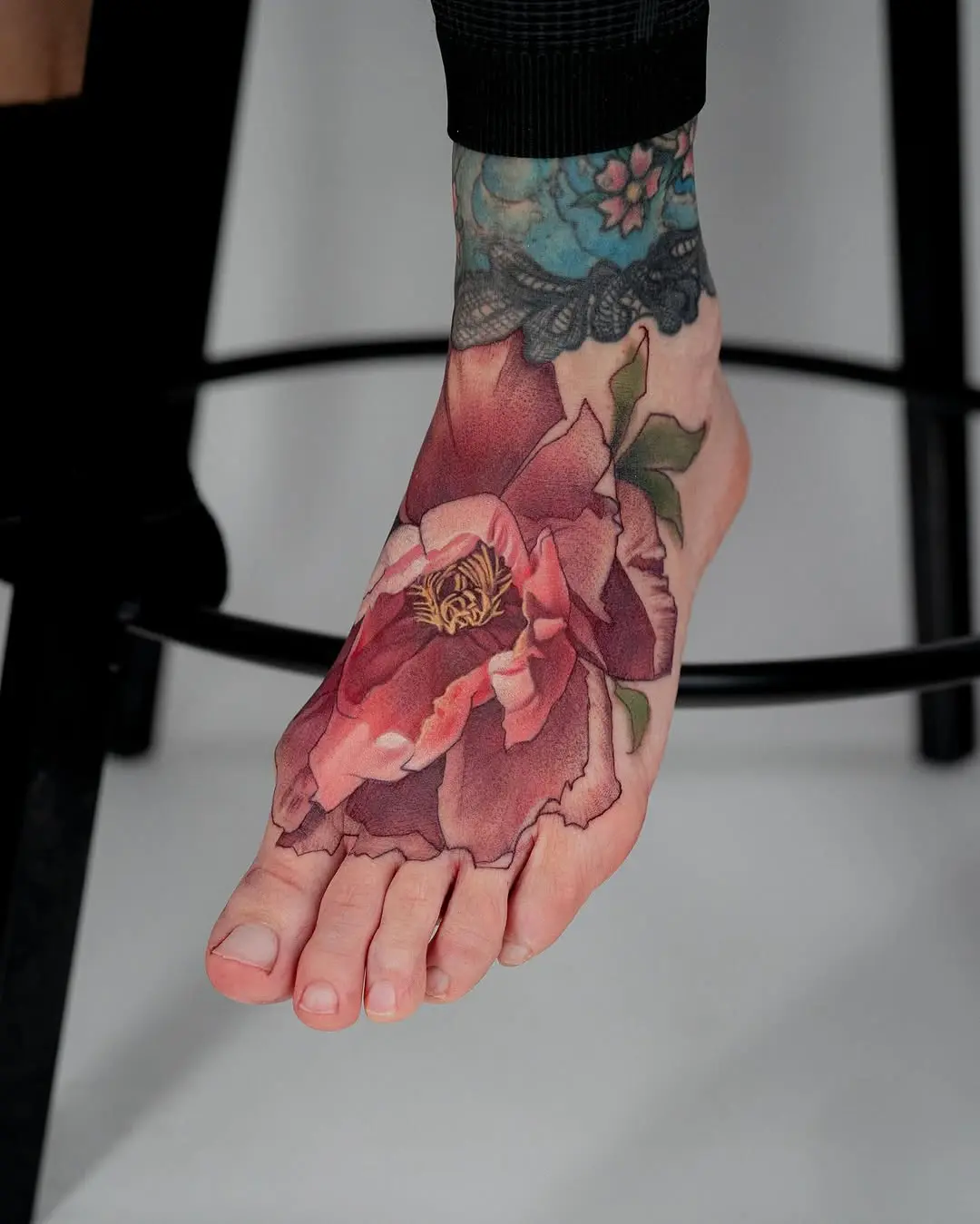 Elegant floral foot tattoo showcasing beauty and artistry