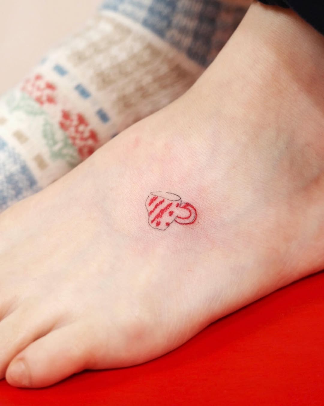 Charming red cup foot tattoo design