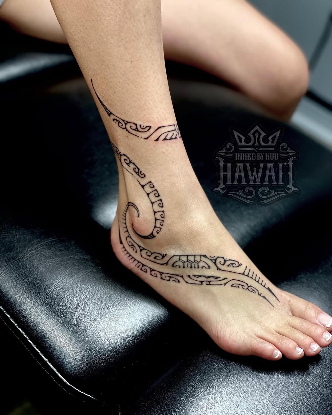 Bold Hawaiian-inspired Foot Tattoo Design