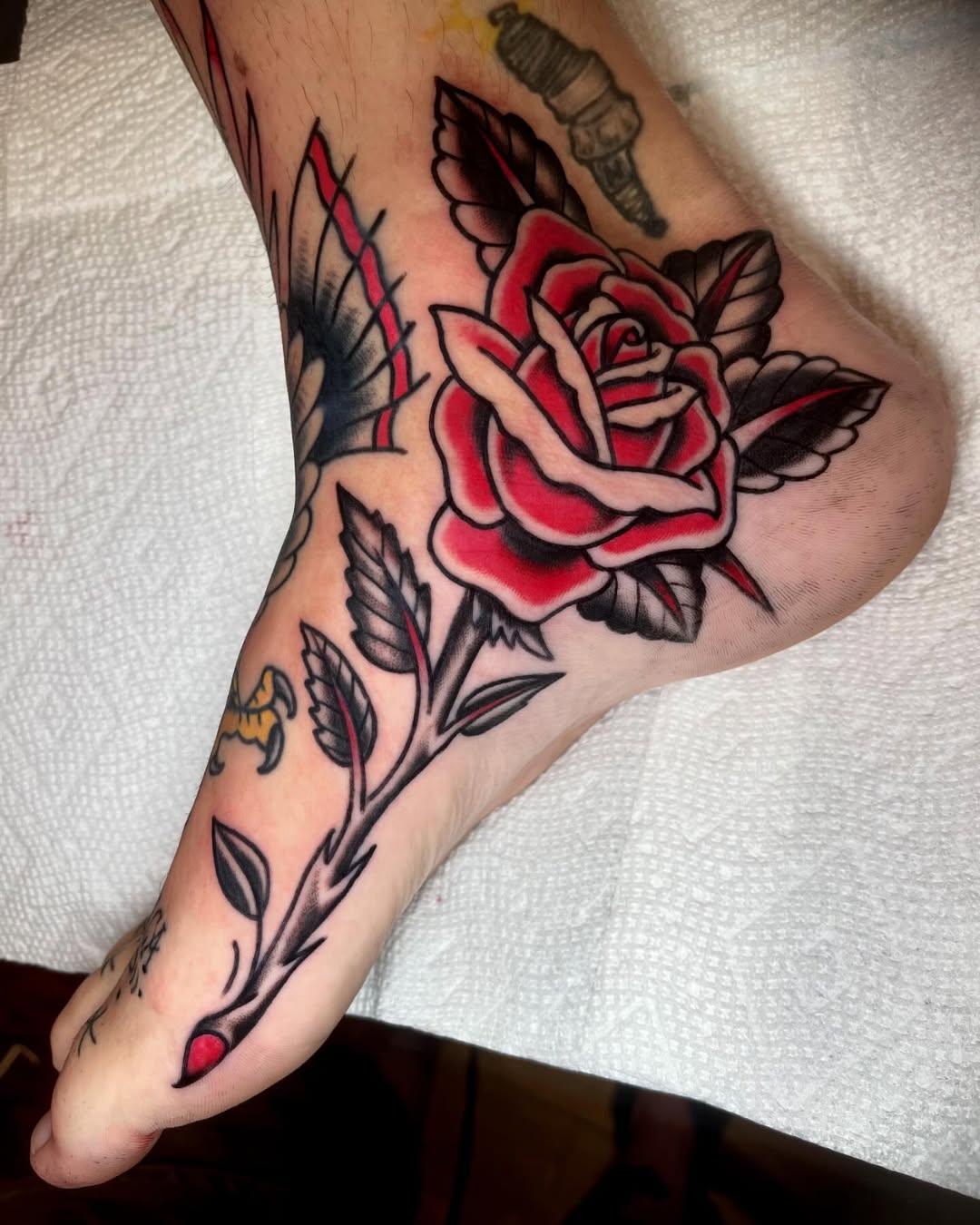 Vibrant Rose Tattoo on the Foot