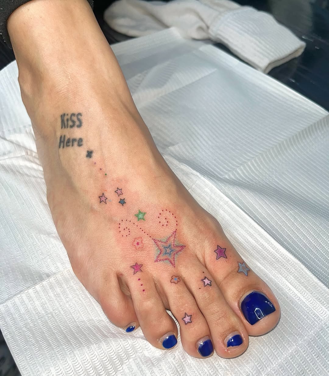 Charming foot tattoo with playful star design