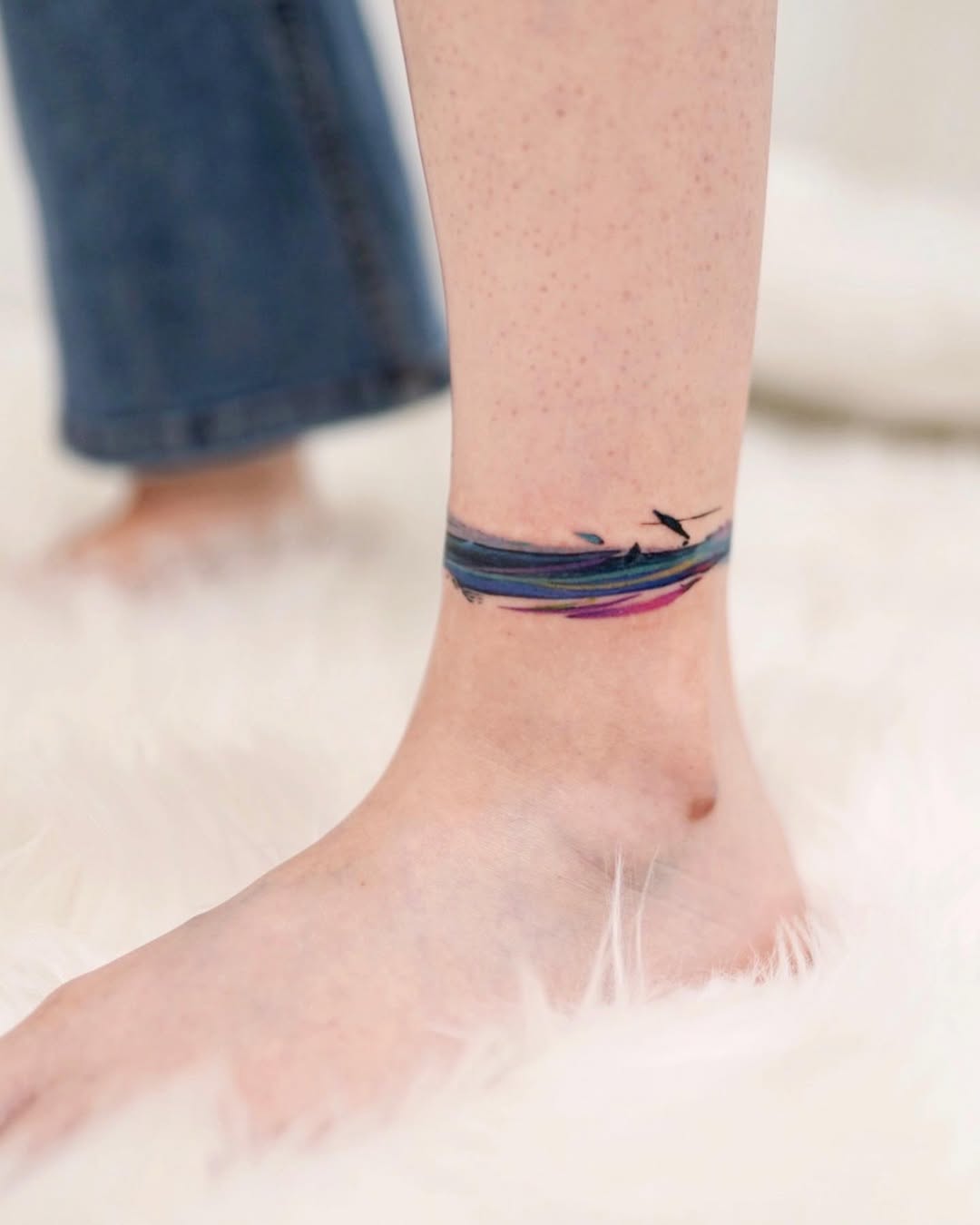 Vibrant wave foot tattoo design