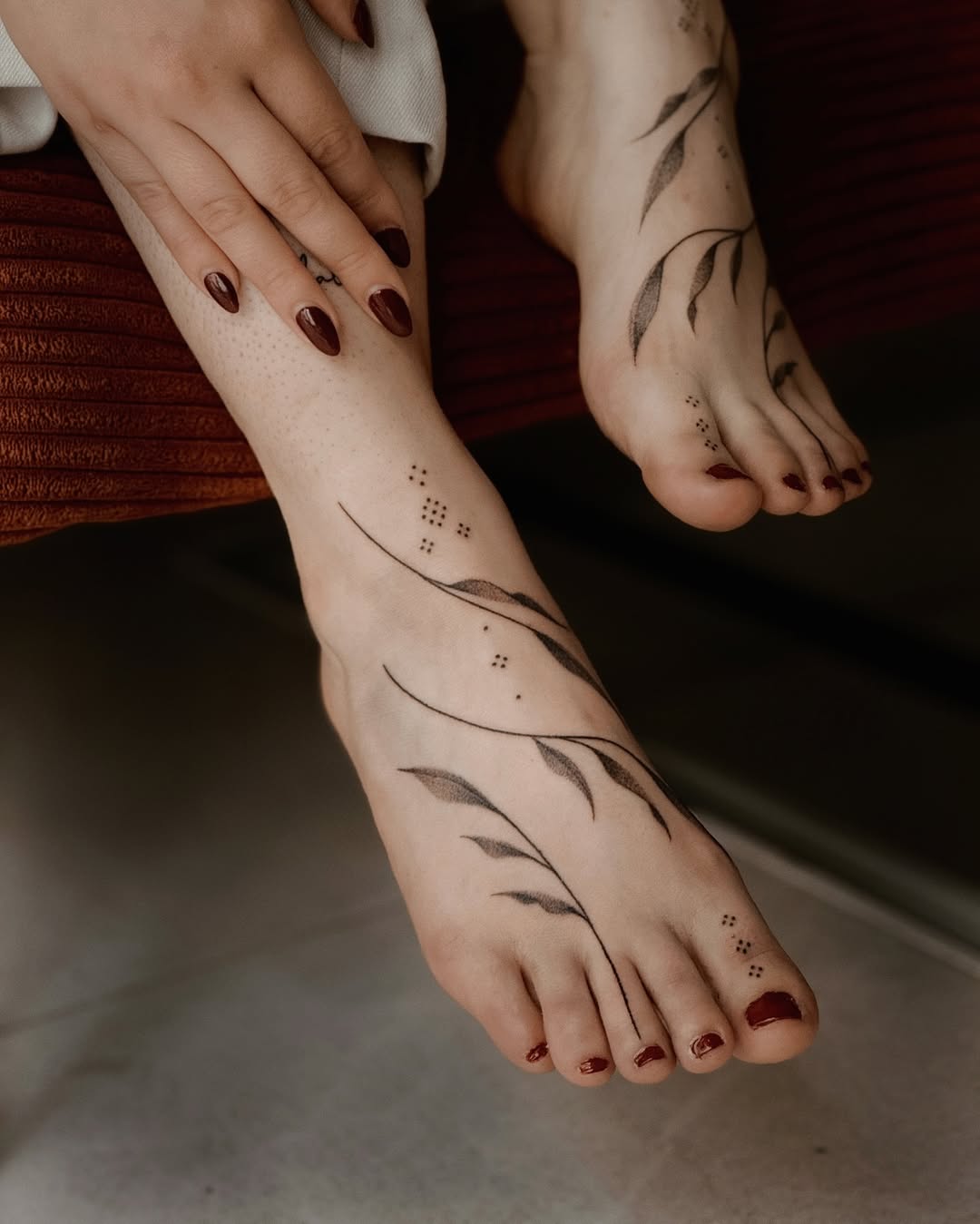 Elegant foot tattoos with leafy designs