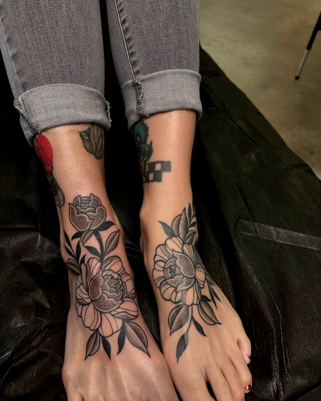 Elegant floral designs on foot tattoos