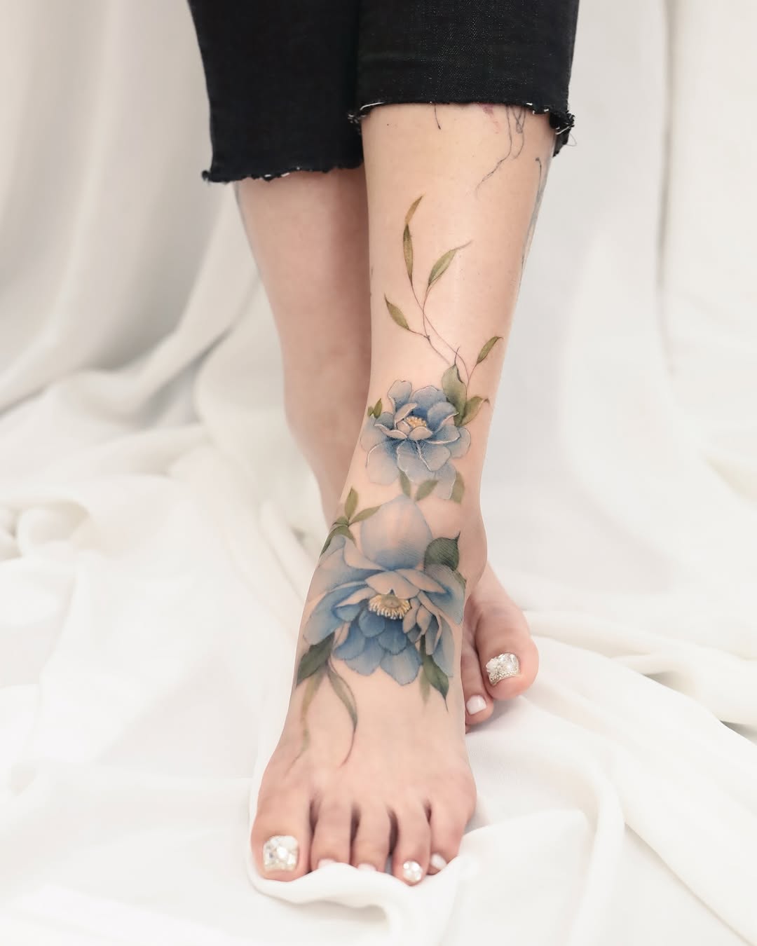 Stunning floral foot tattoo with elegant colors