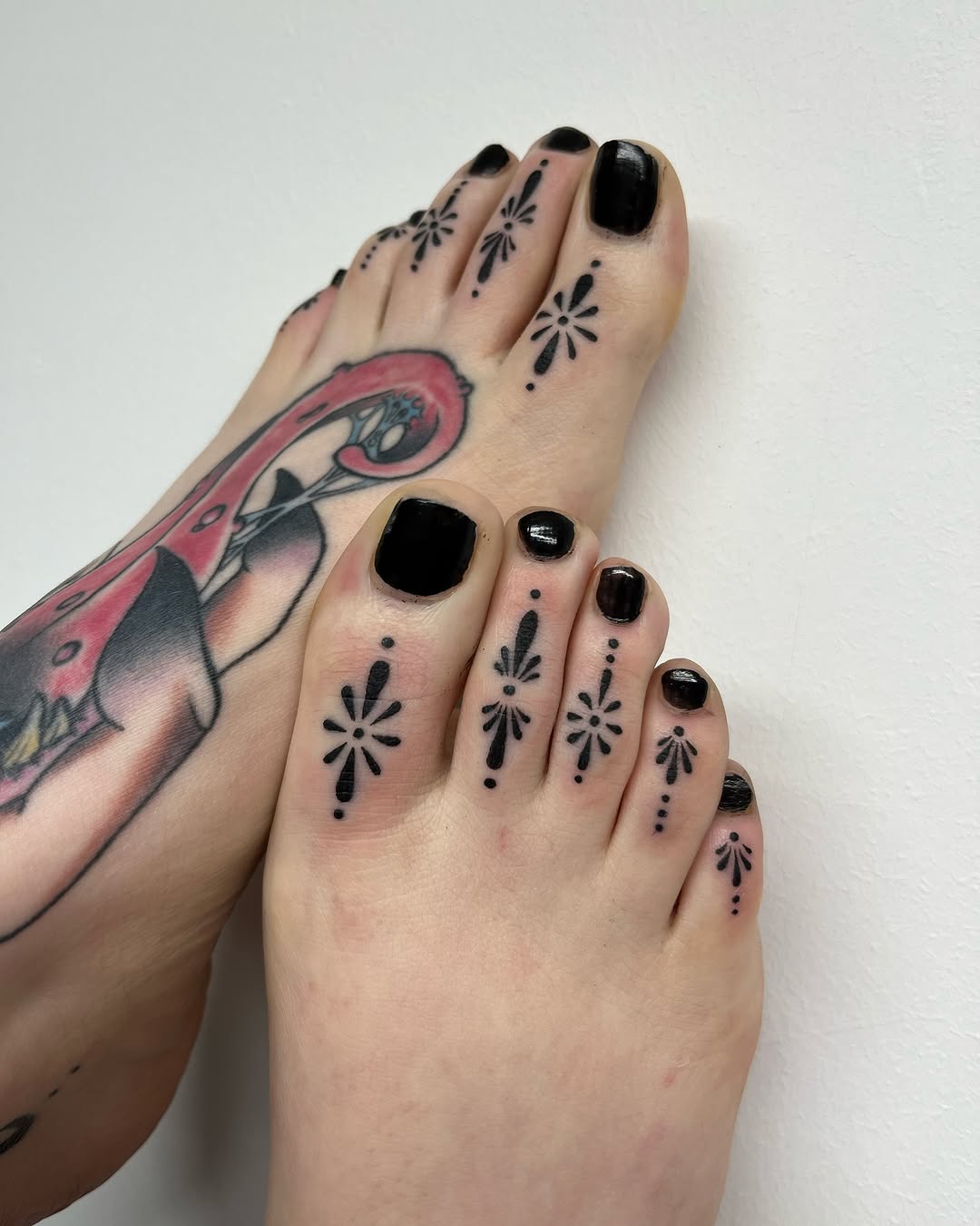 Elegant foot tattoos with floral details