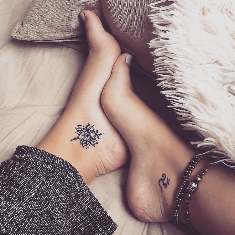 Elegant lotus tattoo adorns the ankle.