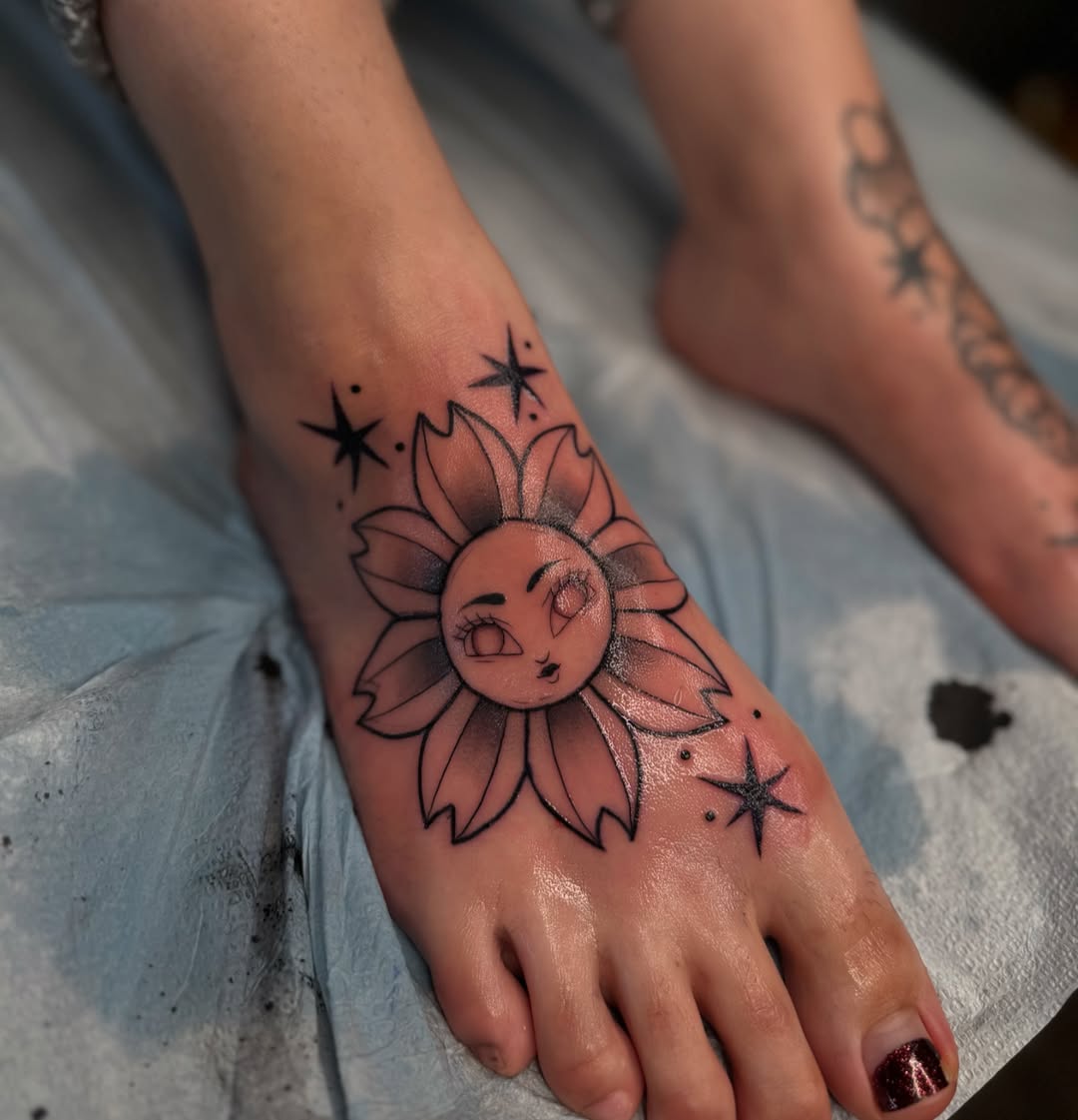 Charming sunflower and moon tattoo on foot