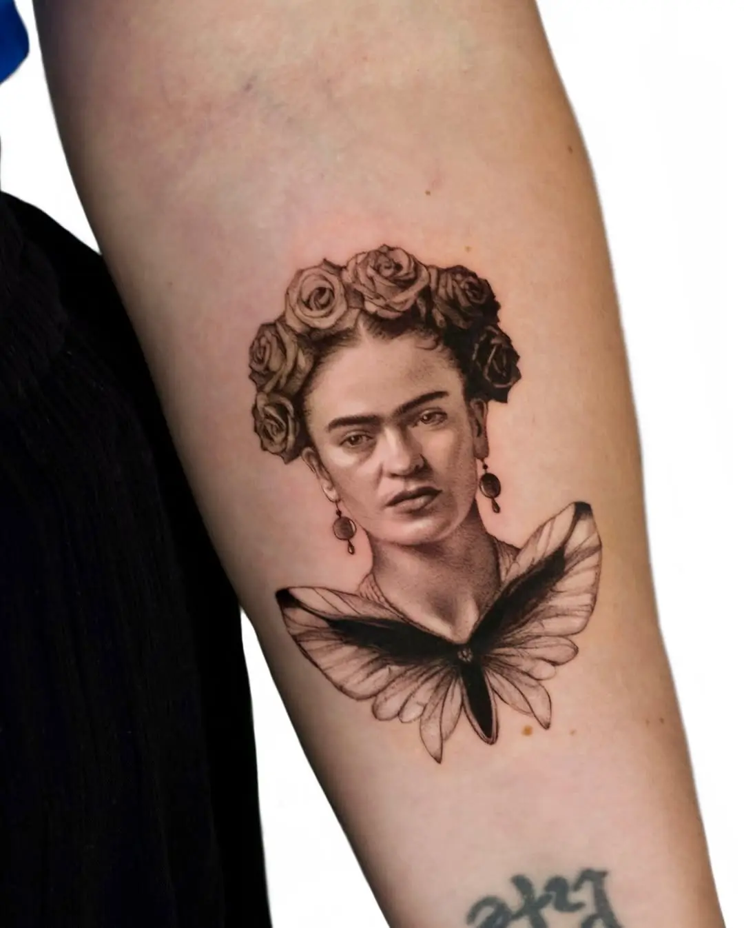 Elegant Frida Kahlo Tribute Tattoo with Butterfly