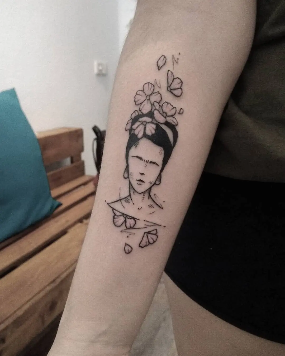 Intricate Frida Kahlo Tattoo with Floral Elements