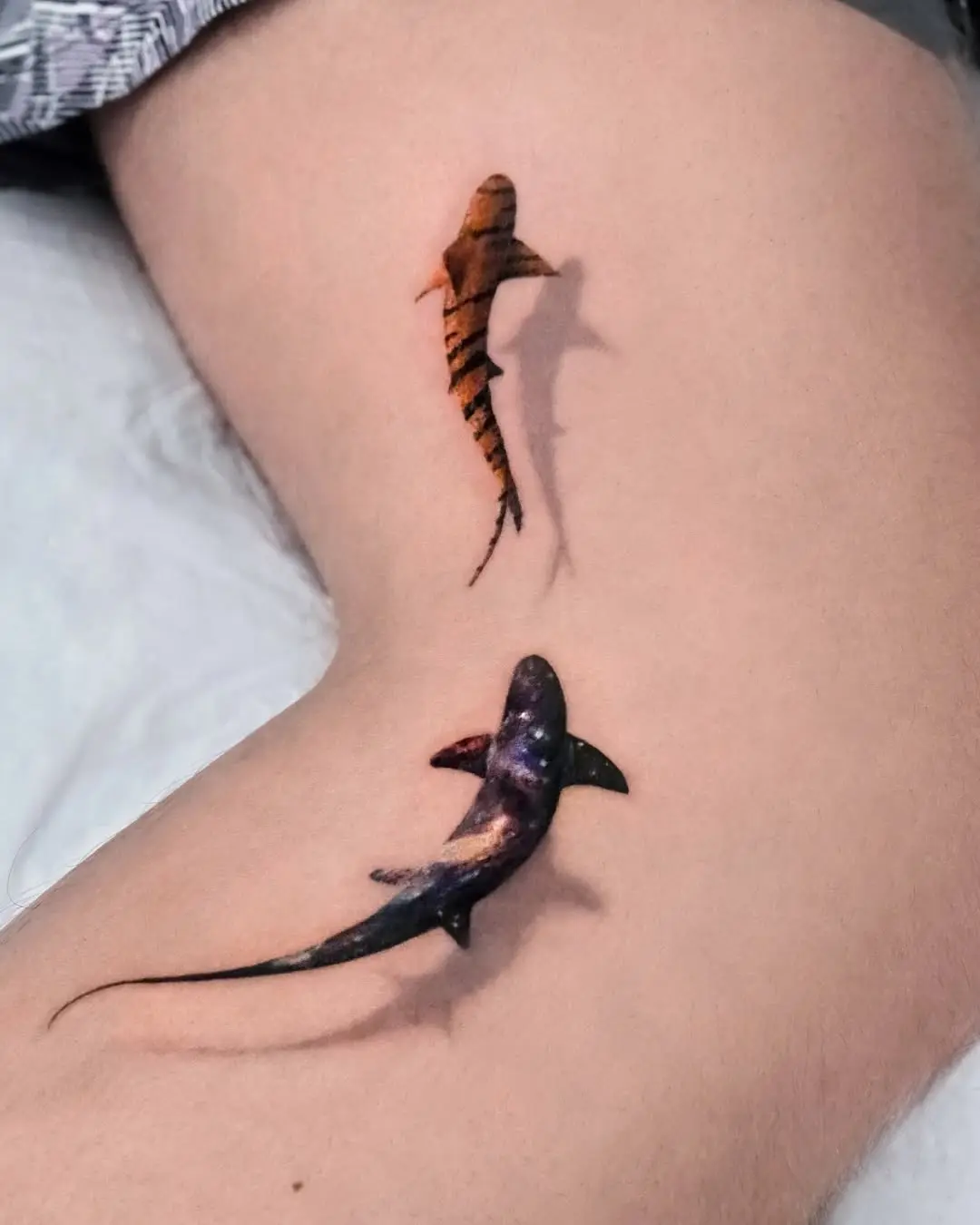 Unique shark tattoos with cosmic flair