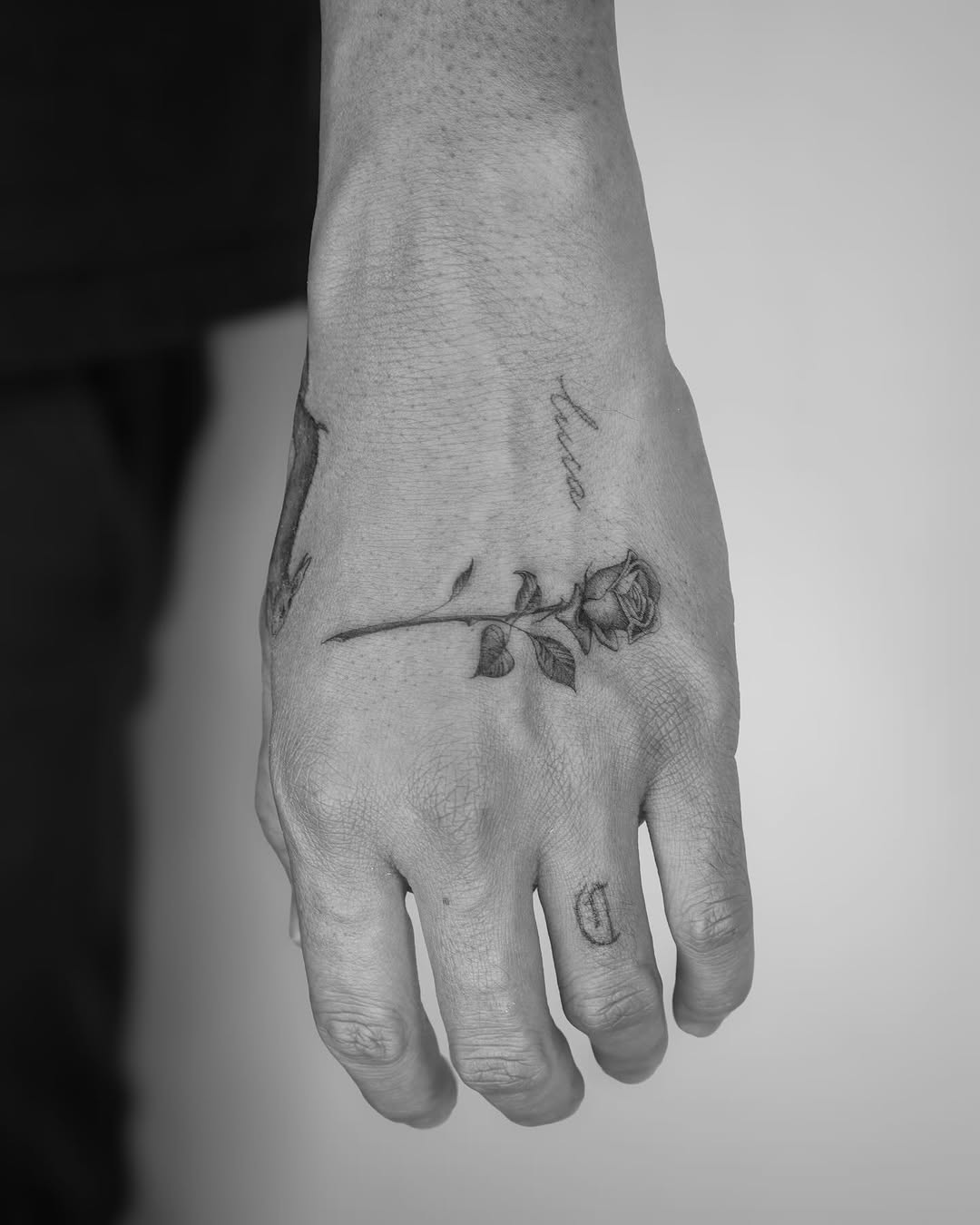 Elegant rose tattoo on a hand