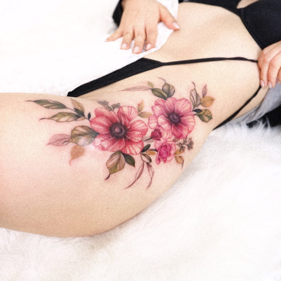 Lovely floral hip tattoo with vibrant colors