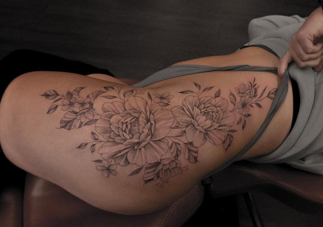 Stunning floral hip tattoo with peonies