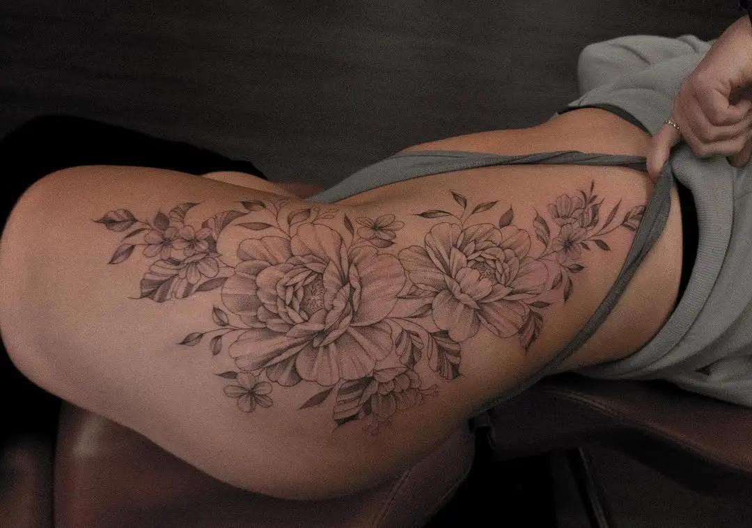 Stunning floral hip tattoo with peonies