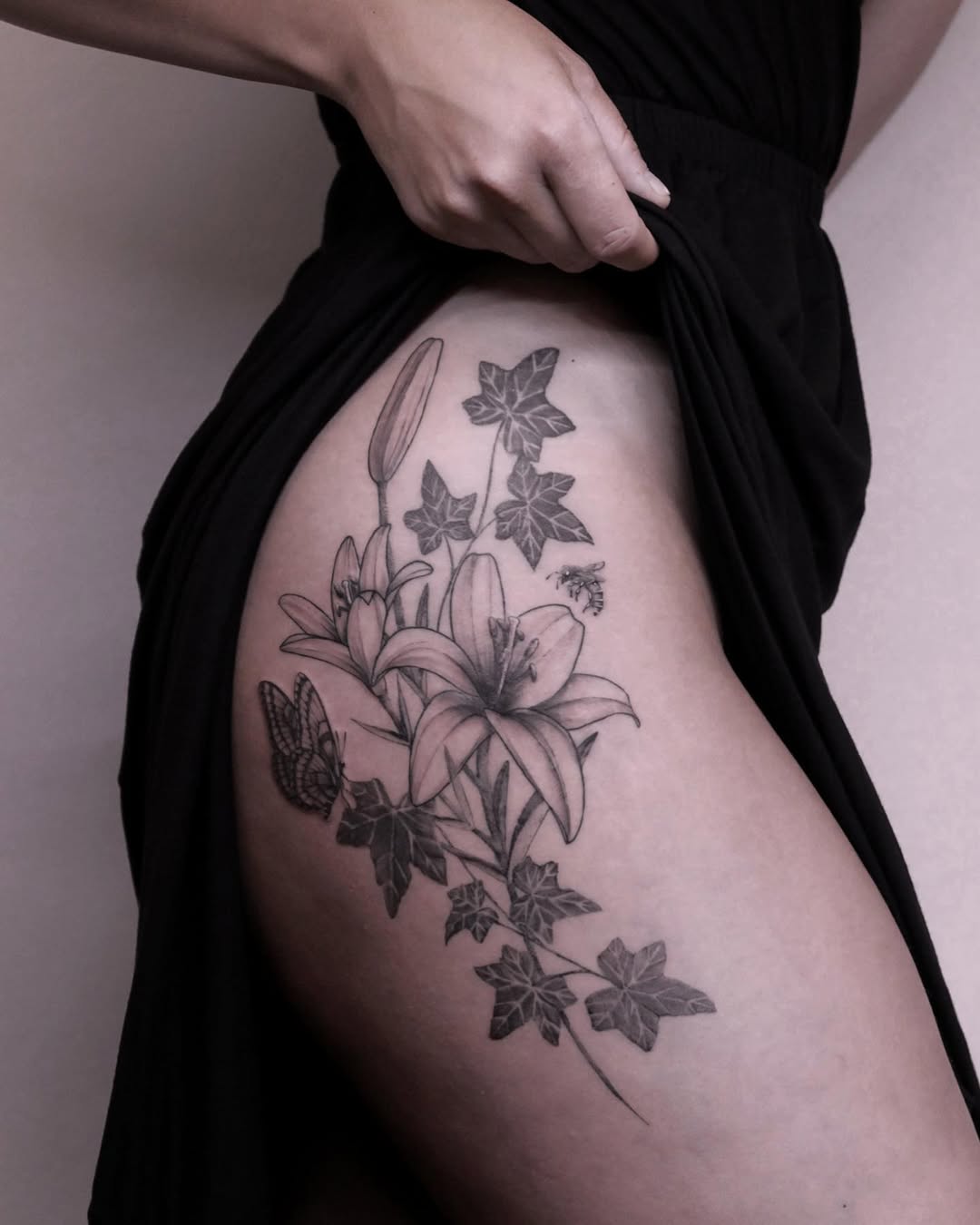 Elegant floral hip tattoo with a natural vibe