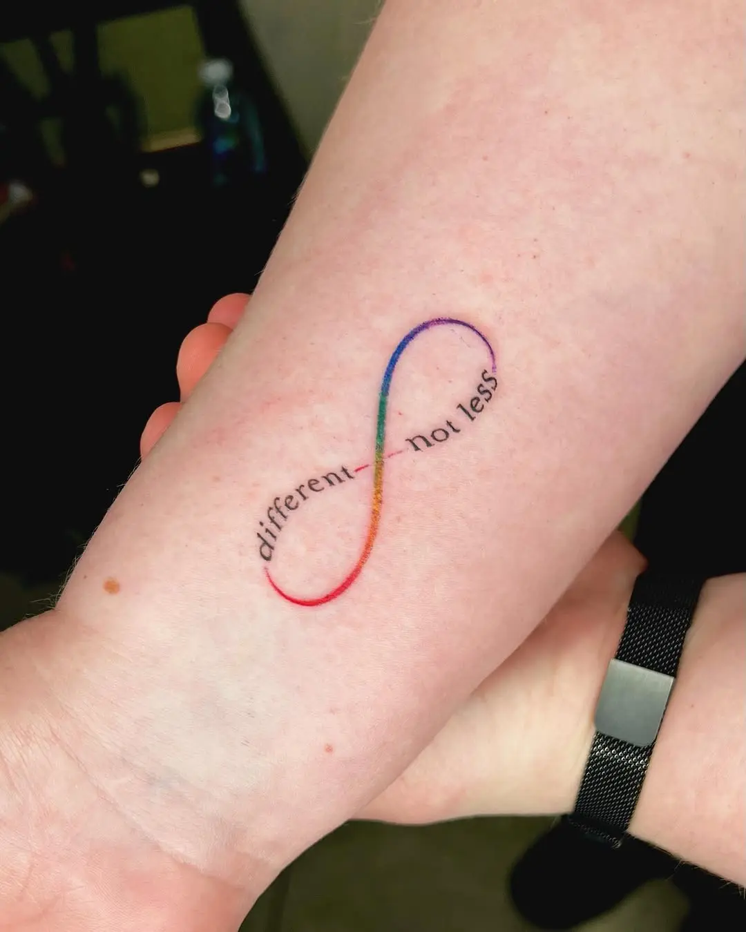 Colorful infinity tattoo with meaningful text