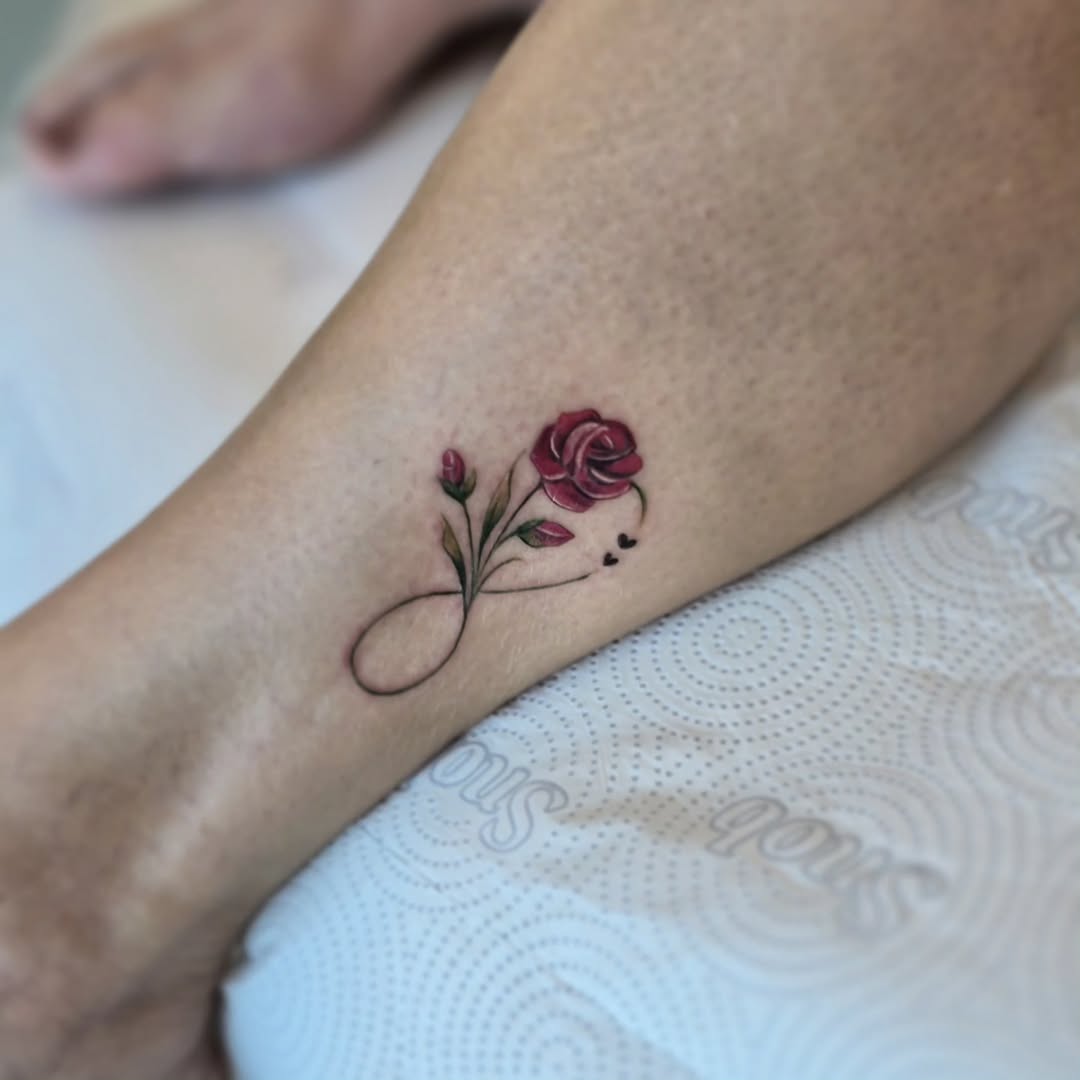A graceful infinity symbol intertwined with a rose
