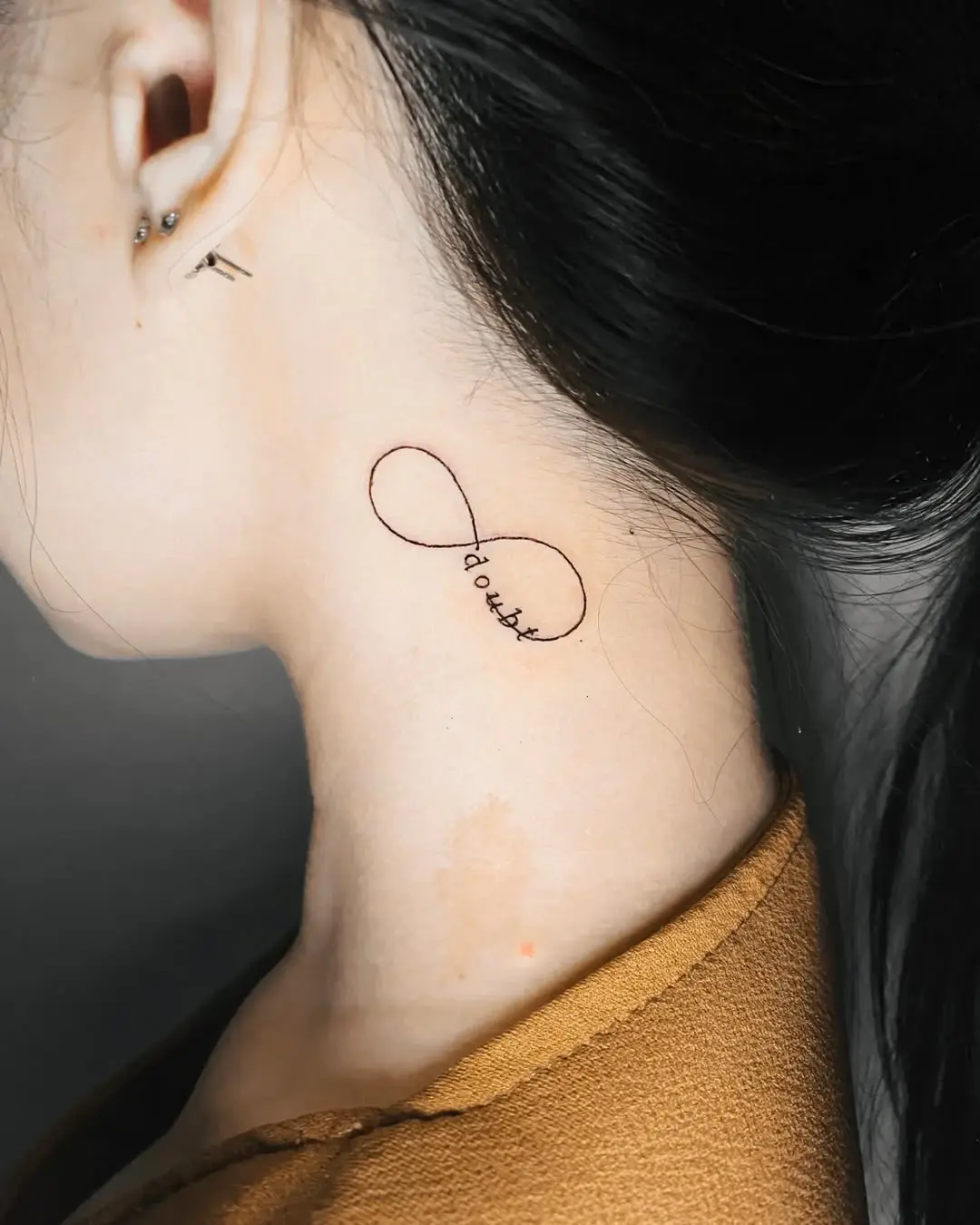 Elegant infinity tattoo with a personal touch